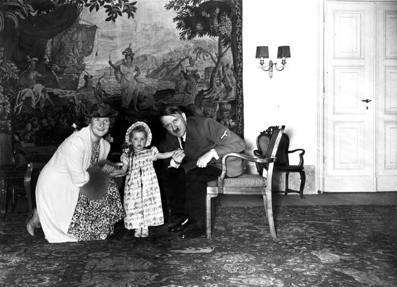 Adolf Hitler with his goddaughter Edda Göring and her mother Emmy Göring during a visit in Berlin's chancellery